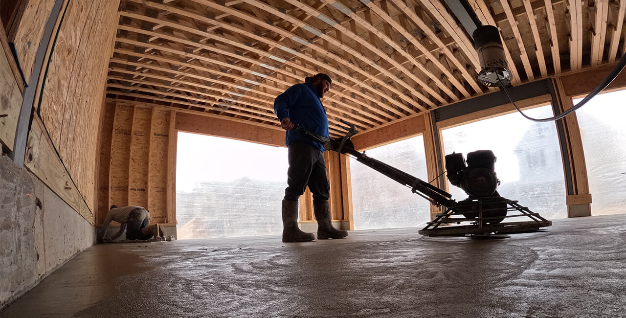 Concrete finishing for slab in residential construction project in Ann Arbor Michigan