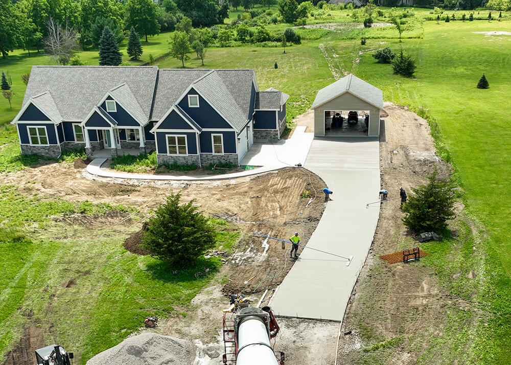 Concrete driveway installation by Cutting Edge Construction & Excavation
