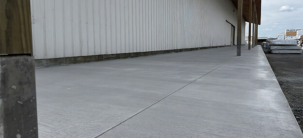 Newly poured concrete flatwork under lean-to at Chelsea Lumber in Chelsea Michigan