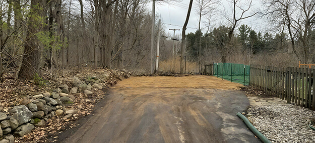 Final grading and site cleanup completed after garage demolition in Ann Arbor.